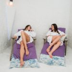 Two women relaxing in a salt cave at Halotherapy